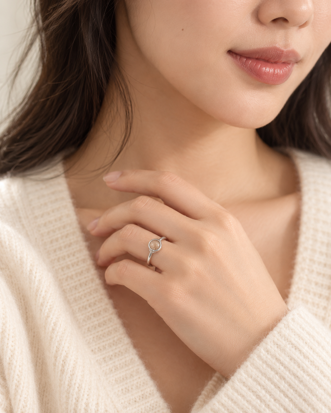Model wearing the Toujours Solidarity silver pet keepsake ring